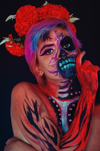 Close-up Of A Woman in Calavera Face And Body Painting