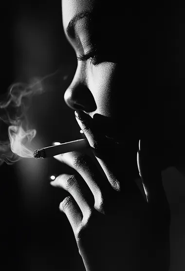 Close-Up of a Woman's Hand Smoking in Mysterious Black and White