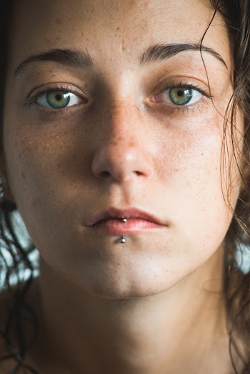 Close-up Of A Young Woman With Lip Piercing