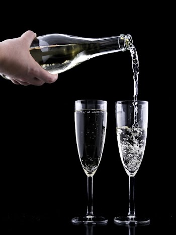 Close-up of Beer Glass Against Black Background