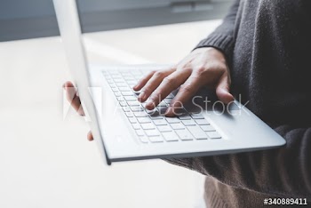 Close up of businessman using laptop