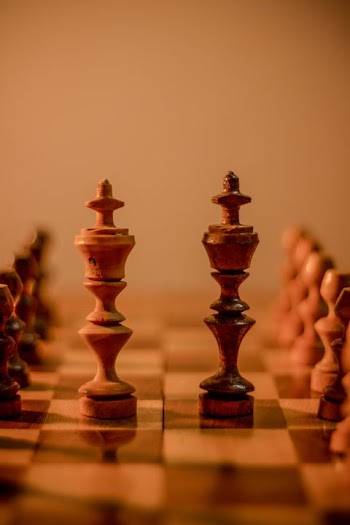 Close-Up of Chess Kings on a Vintage Chessboard
