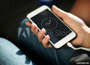 Close up of hands charging mobile phone