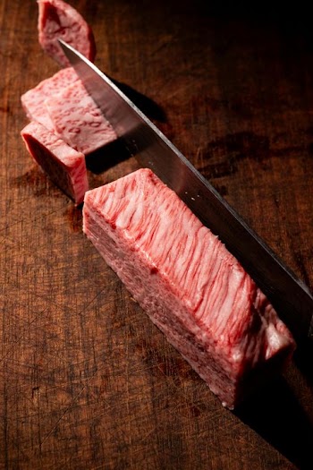 Close-up of Premium Wagyu Beef on Wooden Cutting Board