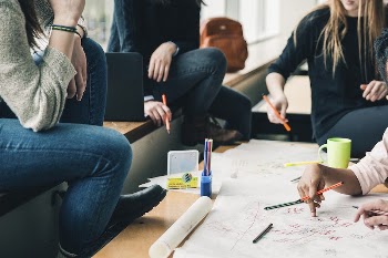 Close up of students around a table | Free Photo - rawpixel