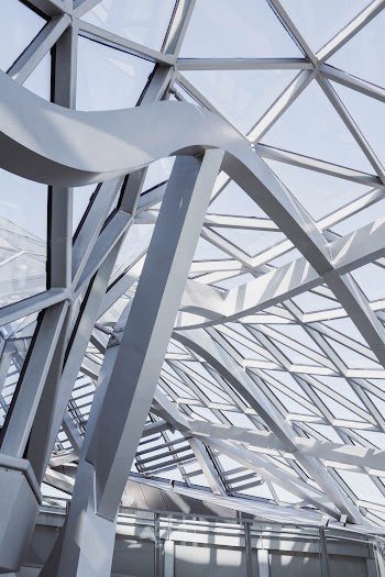Close-up Of The Steel Frame Structure And Glass Panels With Geometric Design Of A Modern Building Interior