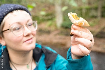 Close-up of woman holding mushroom