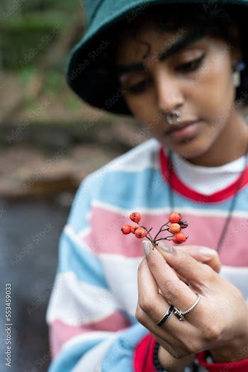 Close-up of woman holding rowanberry