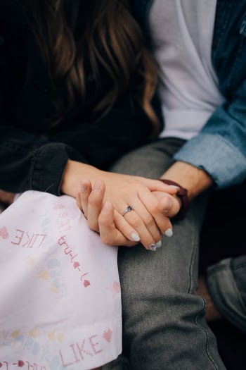 Close-up of Young Couple Holding Hands · Free Stock Photo