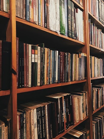 Close-up Photo of a Bookshelf Full of Books