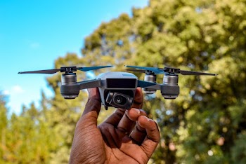 Close-Up Photo of a Gray and Black Drone