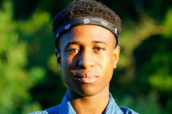 Close-Up Photo of a Man Wearing Black Bandana 