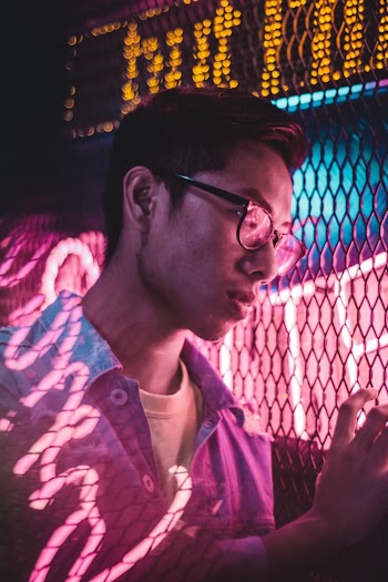 Close-Up Photo of a Man Wearing Eyeglasses