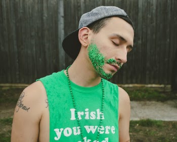 Close-Up Photo of a Man Wearing Green Shirt