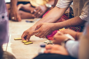 Close-up Photo of a Person's Hand Holding Playing Cards