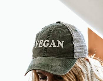 Close-Up Photo of a Person Wearing Vegan Trucker Cap
