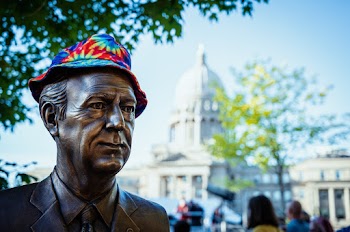 Close-Up Photo of a Statue Wearing a Cap