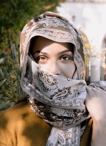 Close-Up Photo of a Woman Wearing Brown and Beige Headscarf