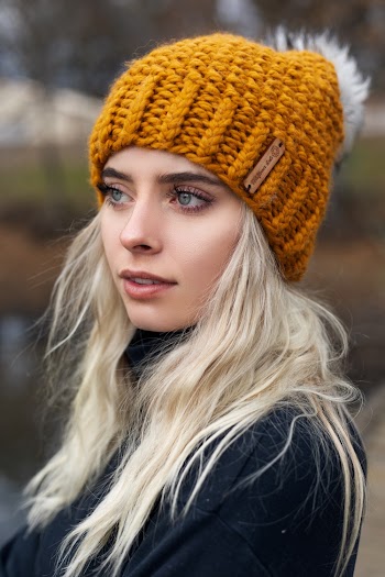 Close-Up Photo of a Woman Wearing Orange Beanie