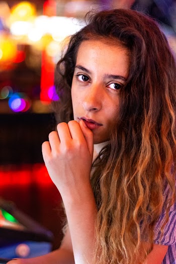 Close-Up Photo of a Woman with Curly Hair