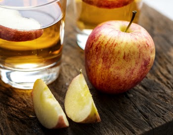 Close-Up Photo of Apples on Wooden Surface