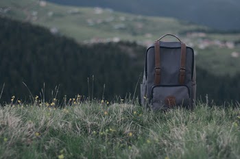 Close-Up Photo of Backpack On Grass