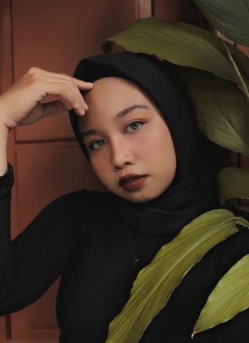 Close-up Photo of Beautiful Woman in Black Hijab Posing 