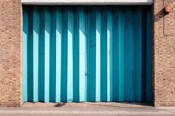close-up photo of blue garage door