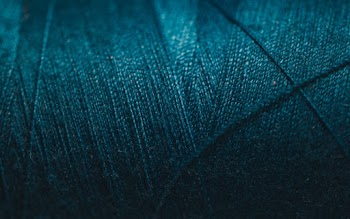 Close-Up Photo of Blue Thread