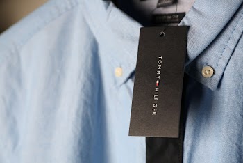Close-up Photo of Blue Tommy Hilfiger Dress Shirt With Tag