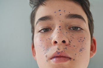 Close-up Photo Of Boy's Face With Paint Splatter