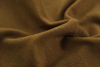 Close-Up Photo of Brown Textile