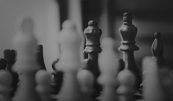 Close Up Photo of Chessboard Pieces