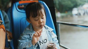 Close-Up Photo of Child Eating Ice Cream