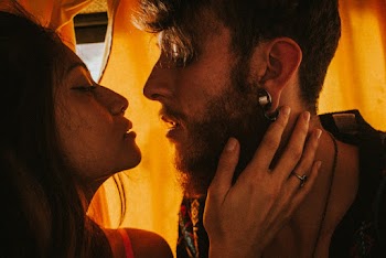 Close-up Photo of Couple About to Kiss