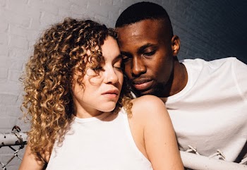 Close-up Photo of Couple Sitting Together
