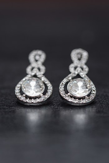 Close-Up Photo of Diamond Earrings