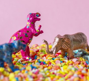 Close-Up Photo of Dinosaur and Elephant Toys