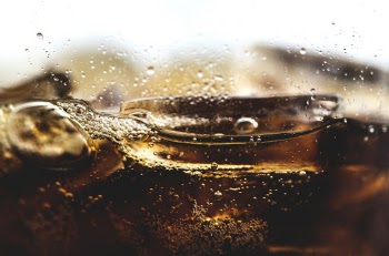 Close-up Photo of Fizzy Drink with Ice-cubes