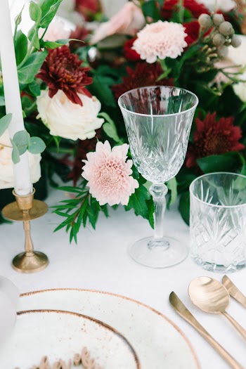 Close-Up Photo Of Glass Near Flowers