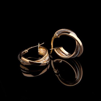 Close-Up Photo of Gold-Colored Latched-back Earrings