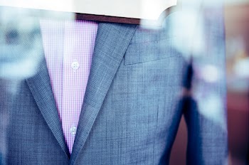 Close-up Photo of Gray Formal Coat with Red Plaid Shirt
