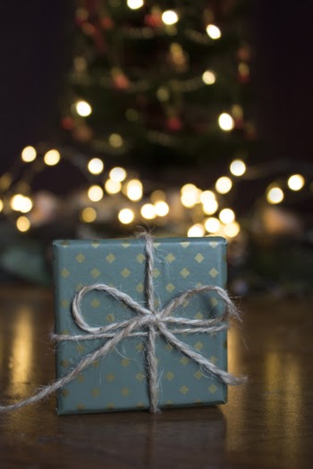 Close-up Photo of Green Gift Box on Brown Wooden Surface