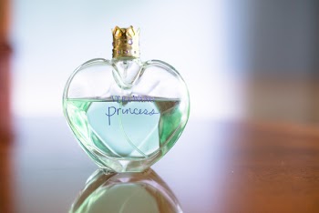 Close-Up Photo of Heart Shaped Perfume Bottle