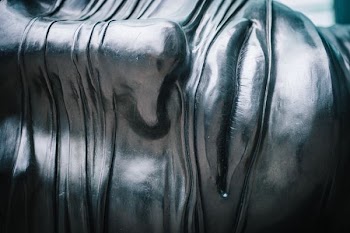 close-up photo of human face with gray paint