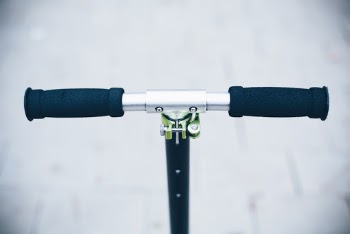 Close-up Photo of Kick Scooter Handlebar
