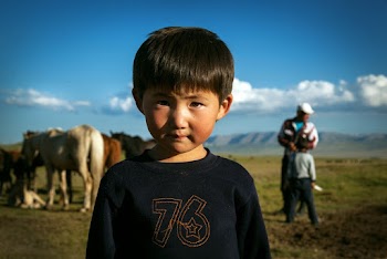 Close-Up Photo of Kid Wearing Black Sweater