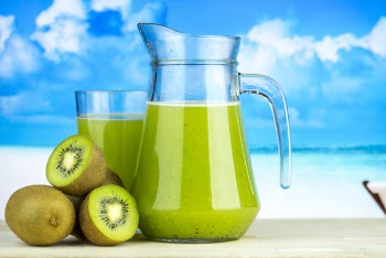 Close-Up Photo of Kiwi Near Pitcher