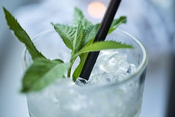 Close-Up Photo of Leaves On Drinking Glass