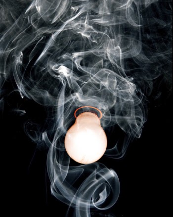 Close-Up Photo of Light Bulb With Smoke